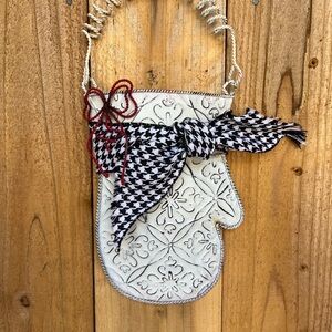 White metal Decorative Mitten with a red wire bow, houndstooth ribbon